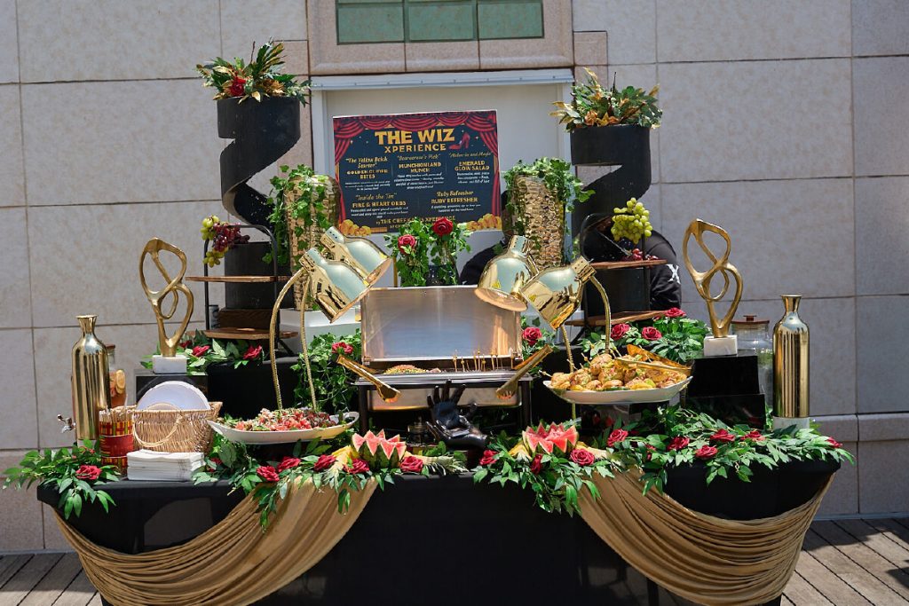 Chef Kaius showcases culinary excellence while serving a custom lunch for the cast of The Wiz—demonstrating the power of opportunity, creativity, and community.