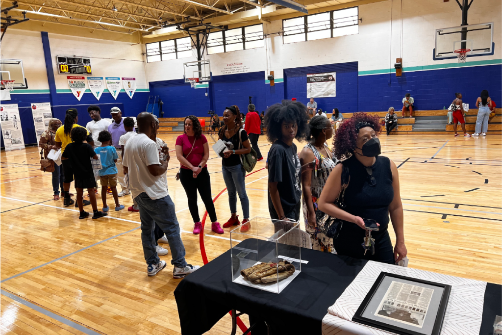 Community members view paraphernalia from the local Negro League Baseball players.