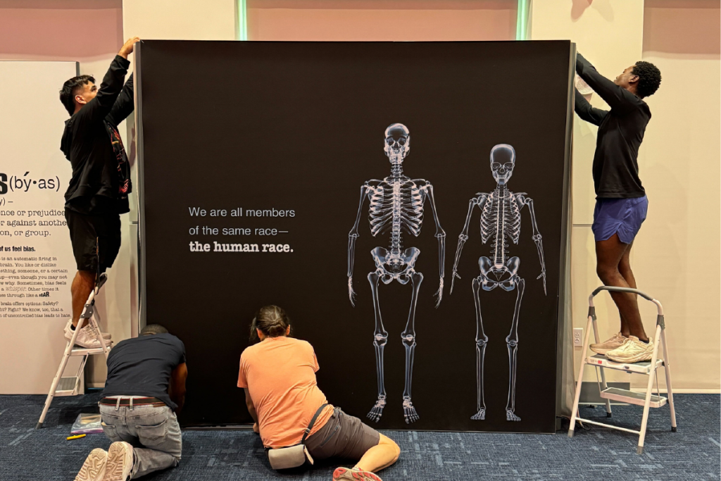 Interns help build the Smithsonian Traveling Exhibition, “The Bias Inside Us”.