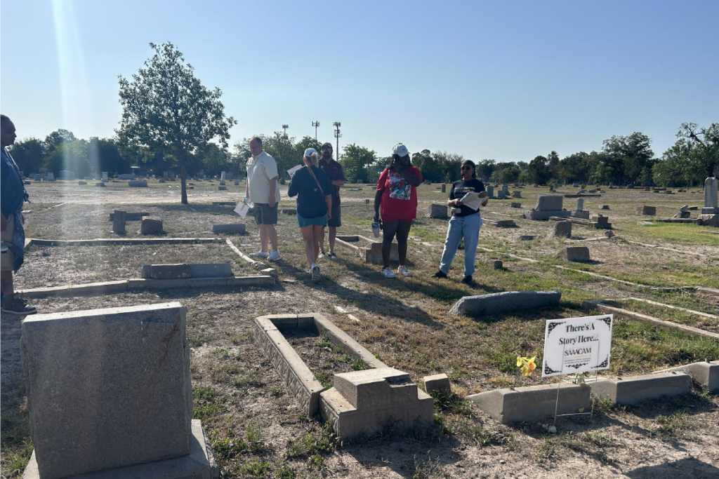Community members discover buried history at City Cemetery #3.