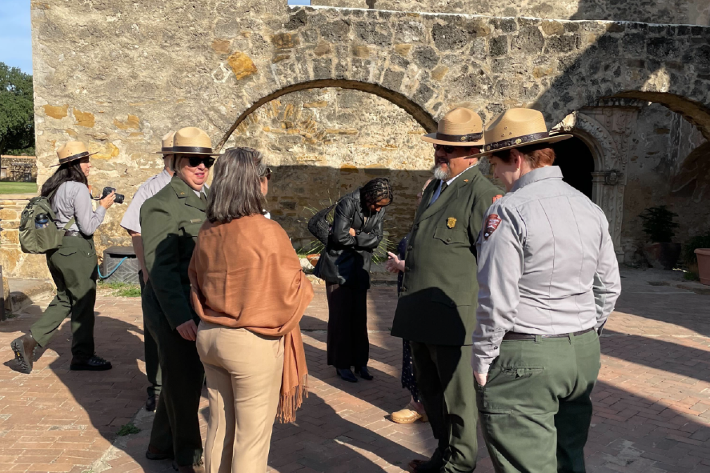 National Park Service (NPS) Rangers and Mari Tamez from the Bexar County Historical Commission attend an event commemorating the collaboration of SAAACAM and NPS.